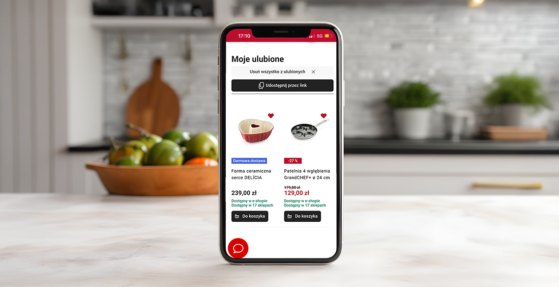 opis: zdjęcie telefonu z otwartą listą ulubionych produktów, który stoi pionowo na kuchennym blacie.